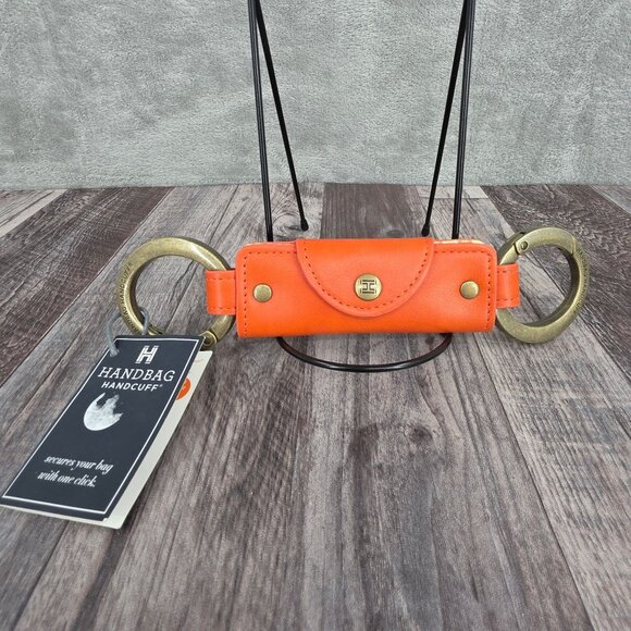 Handbag Handcuff Bag Restraint Security Cuff Strap Gift Orange Faux Leather New - Picture 1 of 8